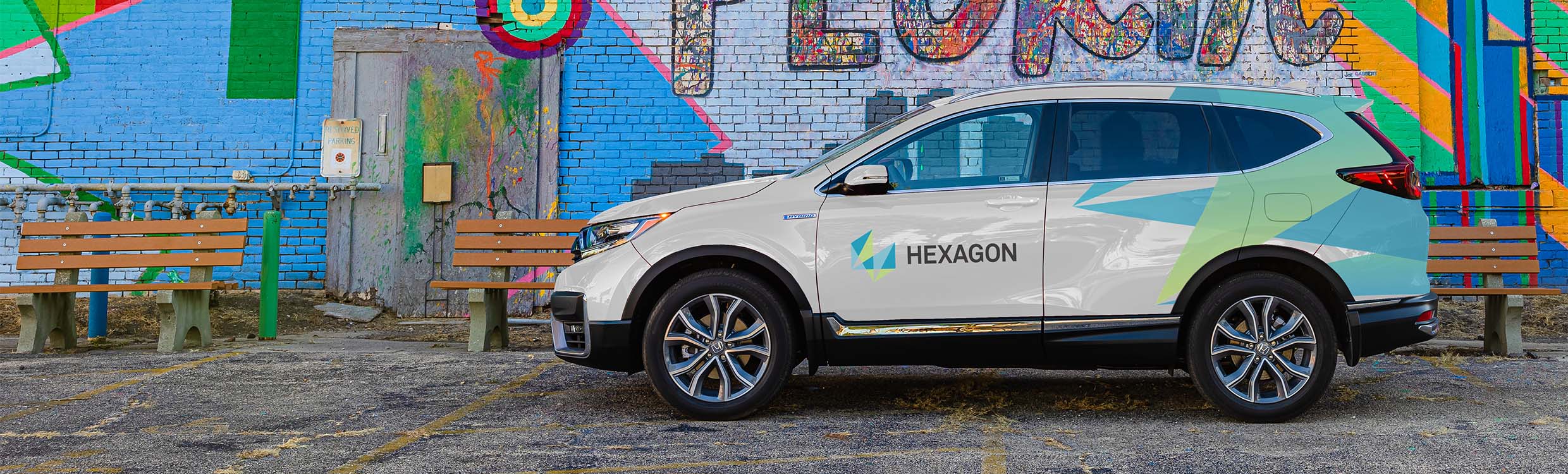 White Hexagon branded Honda CRV on a colorful background